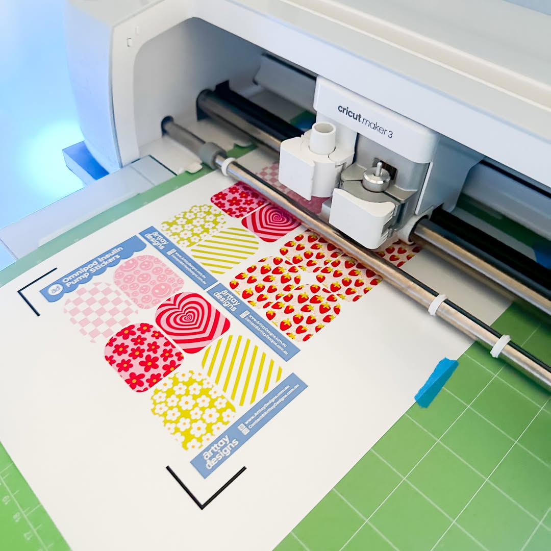 An image of diabetes stickers being cut out